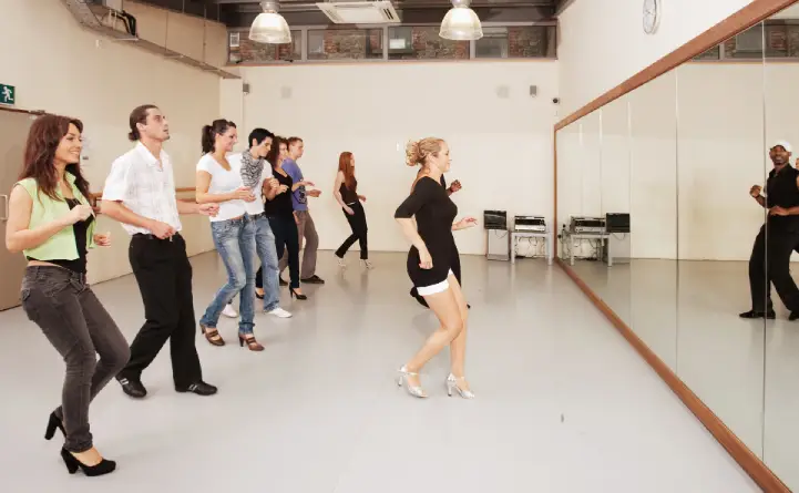 A dance instructor demonstrating steps