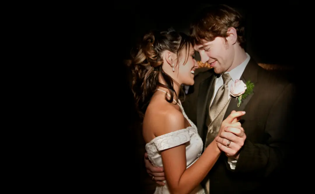 A newlywed couple sharing a romantic first dance